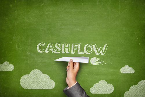 Cash,Flow,Concept,On,Green,Blackboard,With,Businessman,Hand,Holding